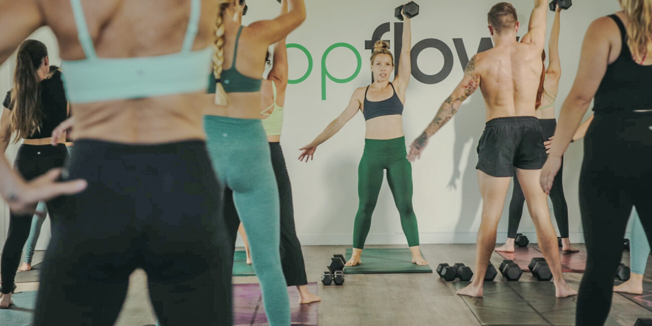 San Diego Fitness instructor leading class at Popflow Studios.